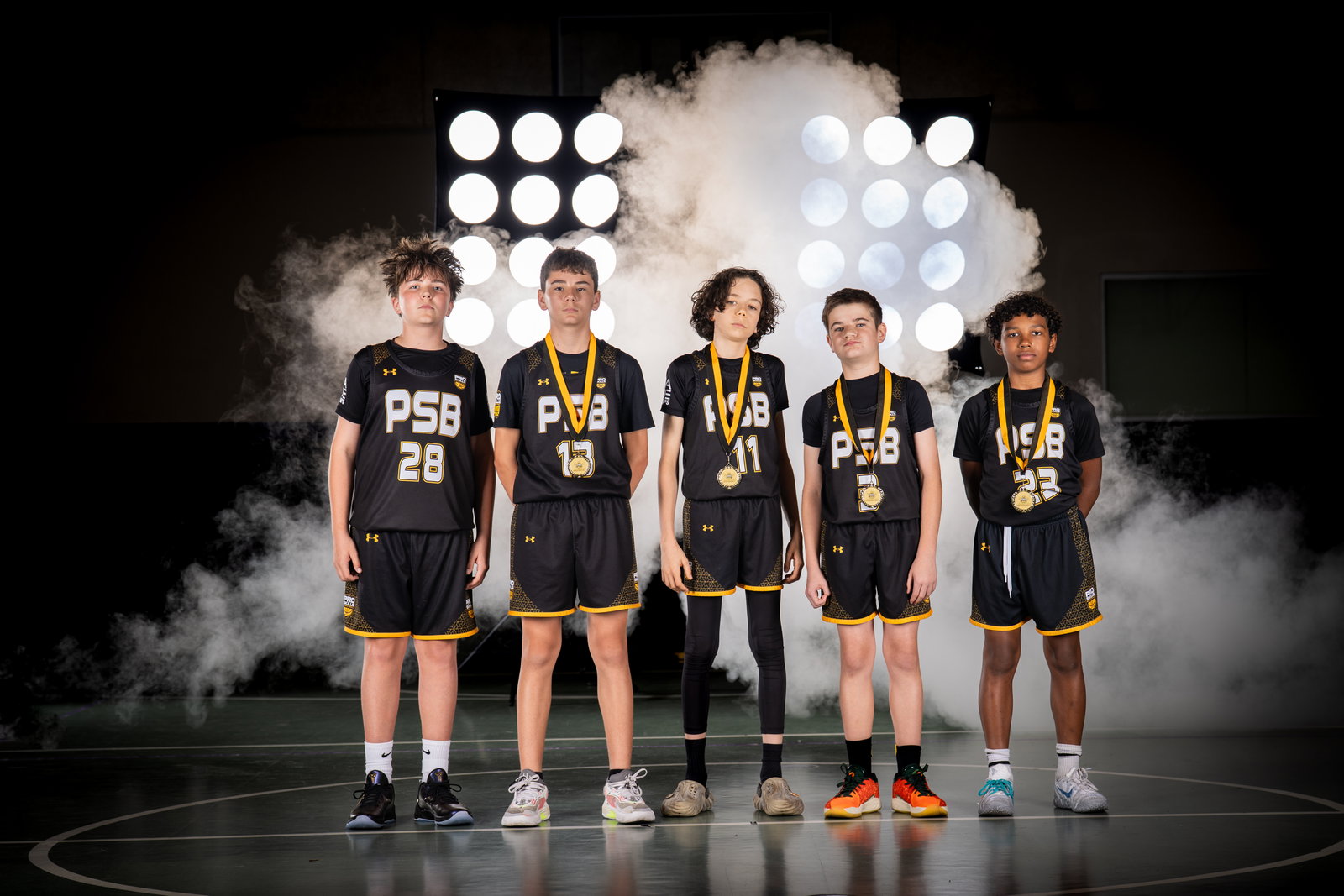 PSB team celebrating with medals after a tournament