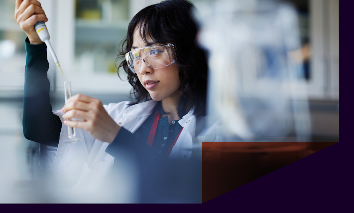 A scientist holds a test tube in lab