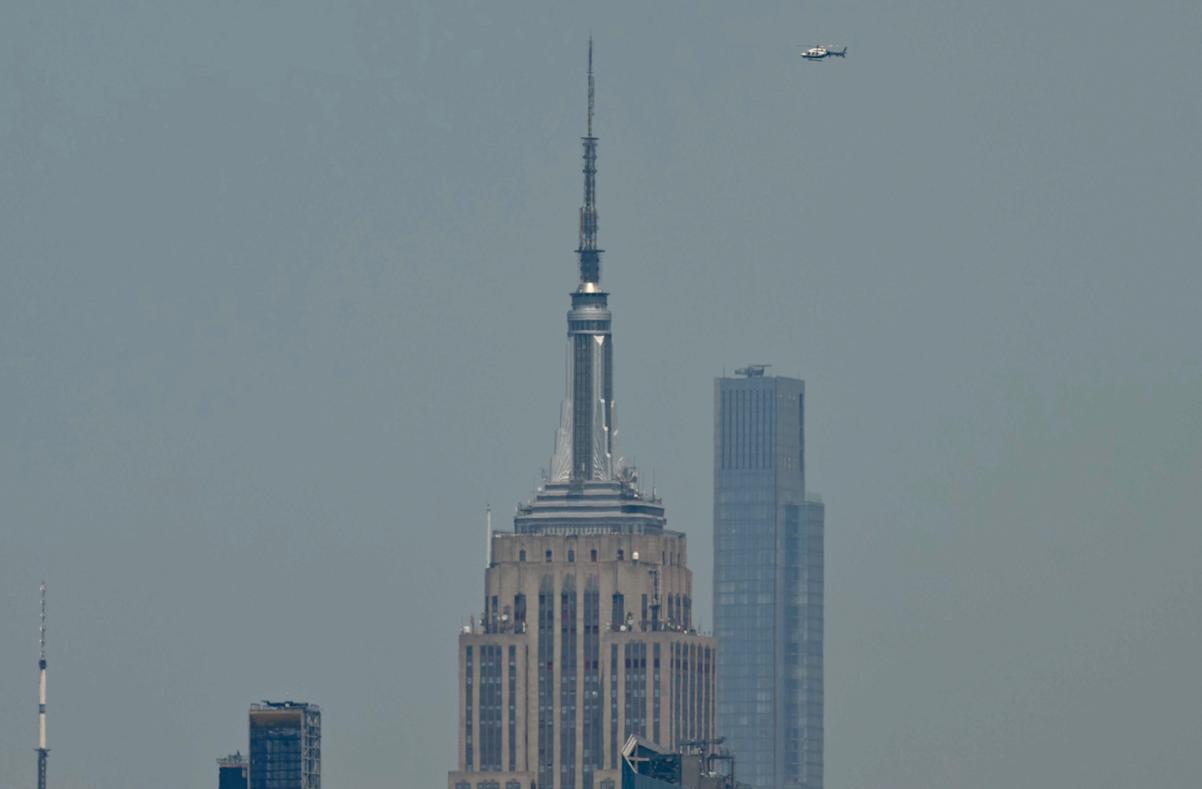 masked climbers scale empire state building