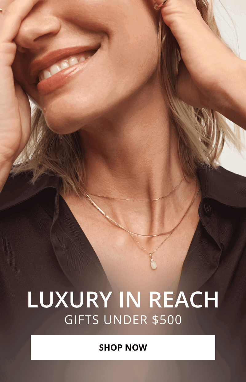 Woman wearing layered gold necklaces. Luxury in reach. Gifts under $500. Click shop now.  