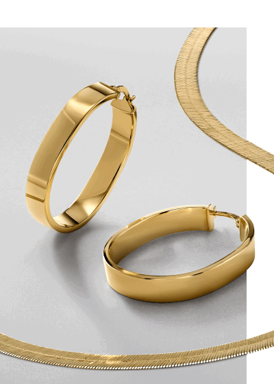 A gold set featuring hoop earrings and matching necklace. 