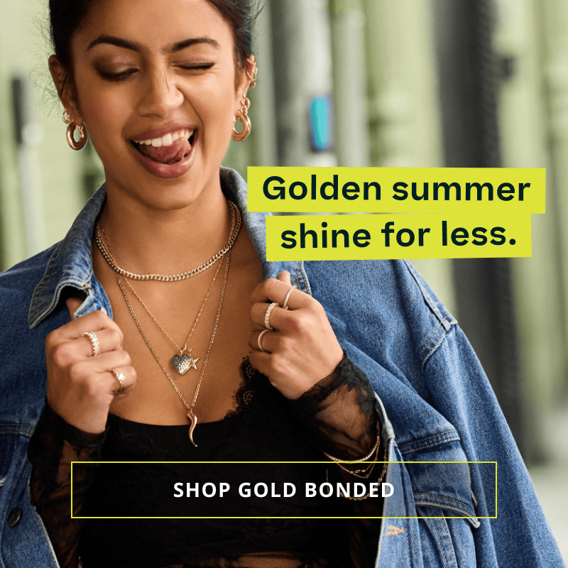 Model with bold gold ear stack & pendant chains.  Golden summer for less. Click here to shop gold bonded