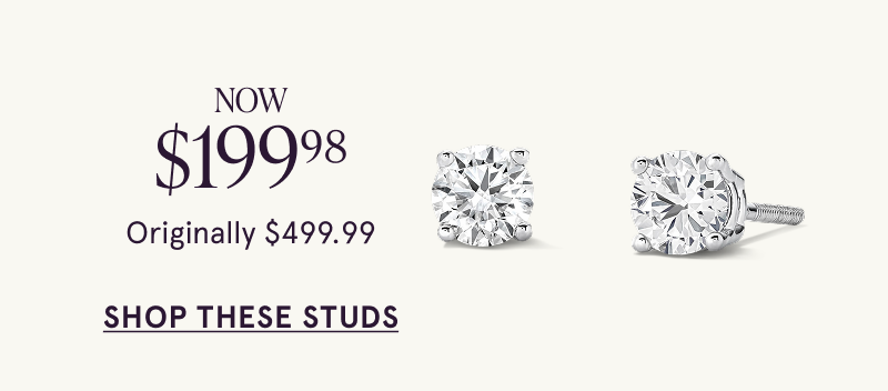 A pair of white metal diamond stud earrings. Was $499.99, now $199.98. Click here to shop this style