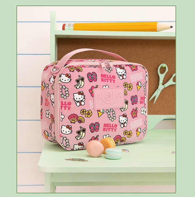 ALOHA Collection Pink Lunchbag displayed against a cork board background.