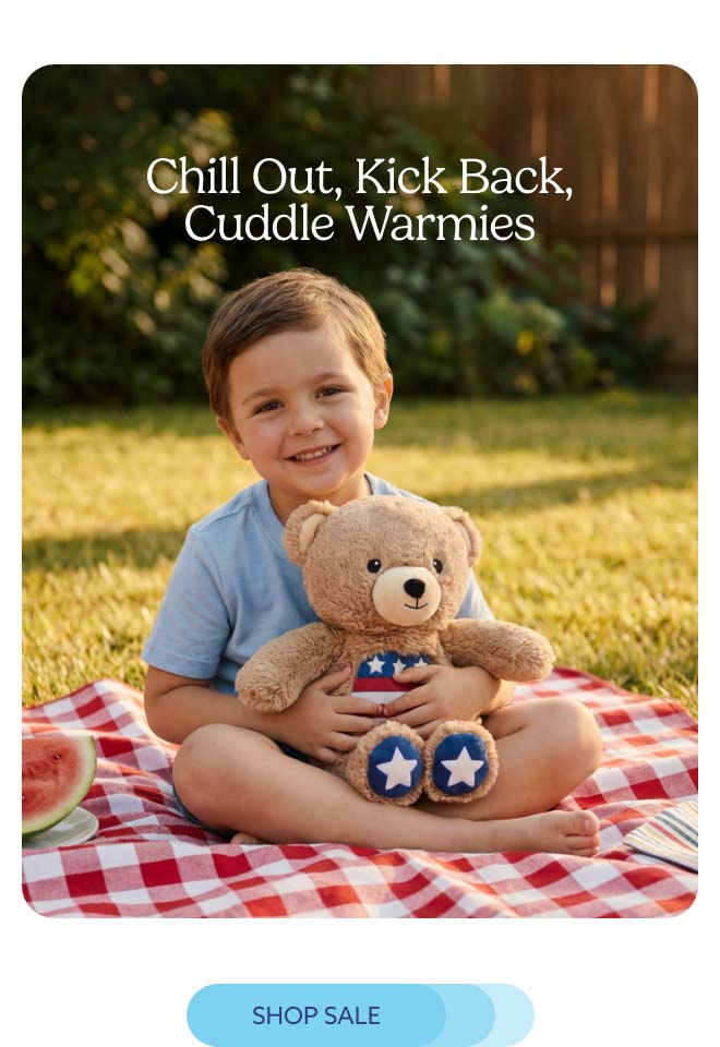 A little boy with USA Bear Warmies. Shop Sale.