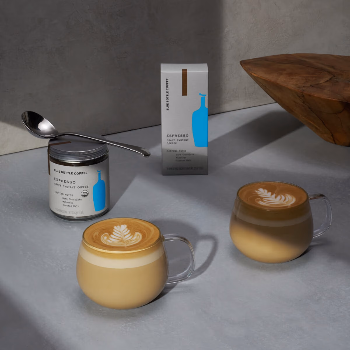 Image of coffee containers and coffee cups.