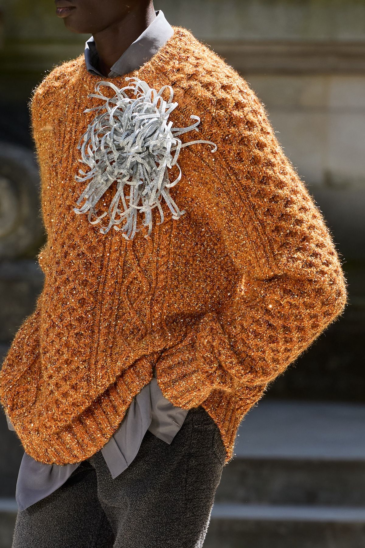 male model in jumper with oversized brooch