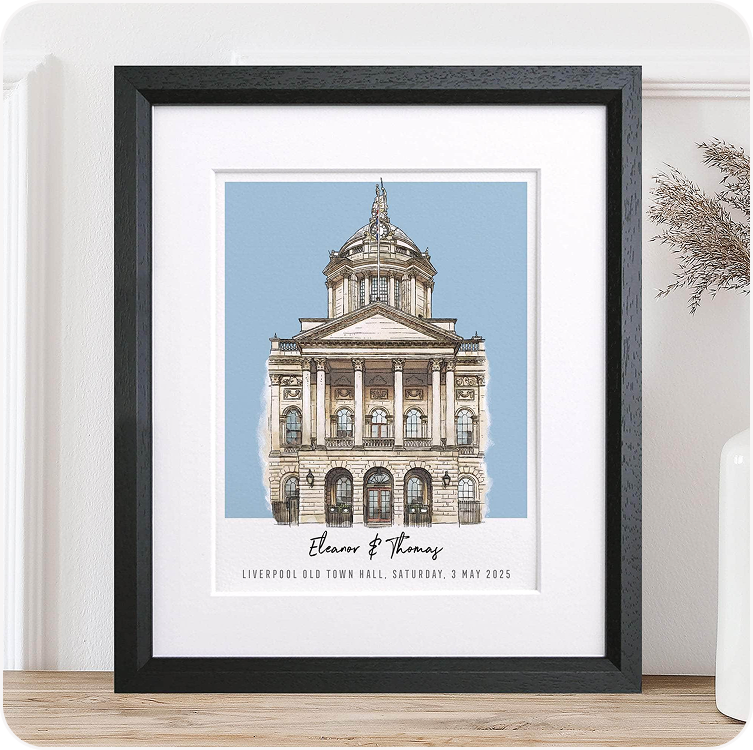 A framed colour block illustration of a grand wedding venue, personalised with the couple's names beneath