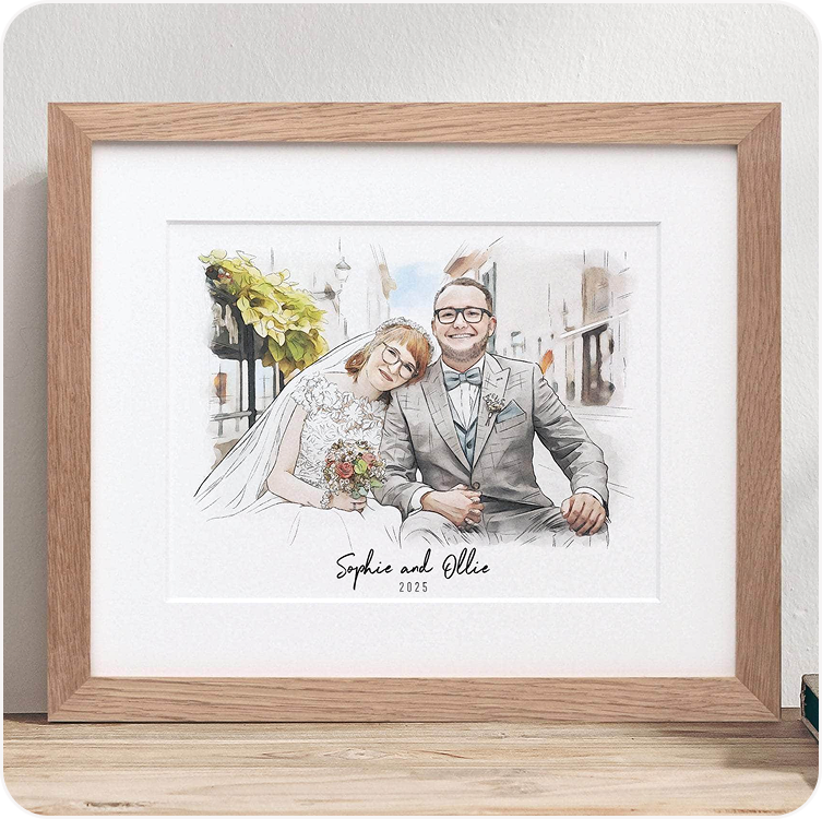 A framed watercolour illustration of a bride and groom, personalised with their names beneath