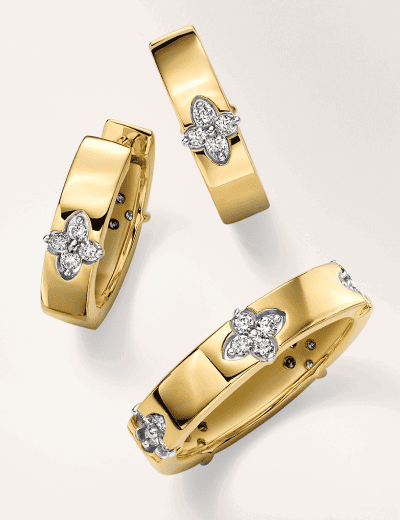 Matching set of earrings and ring in yellow gold with diamond floral accents. 