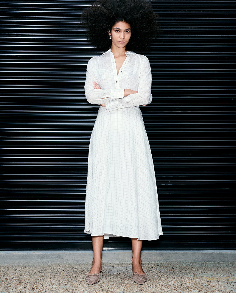 Woman wearing a White Mix Lyocell Rich Checked Collared Oversized Shirt and Midi Skirt