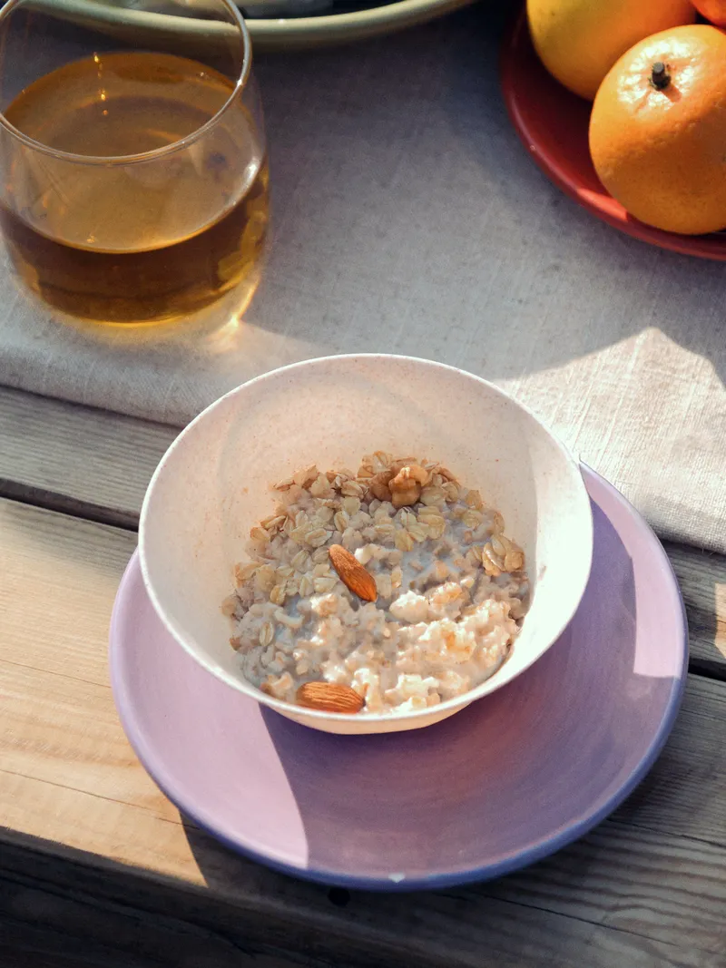 Image may contain: Bowl, Breakfast, Food, Alcohol, Beer, Beverage, Cereal Bowl, Citrus Fruit, Fruit, Orange, and Plant