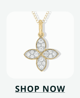 Gold four-petal flower pendant, filled with pave diamonds. Click here to shop now