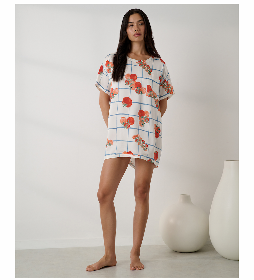 woman in tomato print top