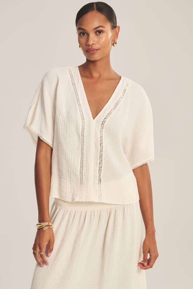 Image shows a model wearing the Verna Top in Coconut.