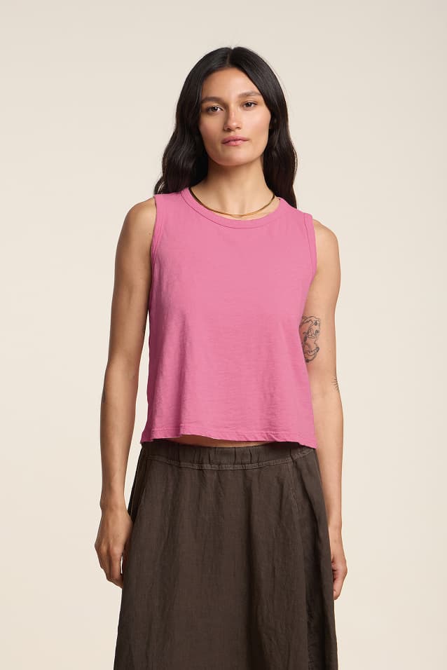 Image shows a model wearing the Ambria Top in Sherbert.