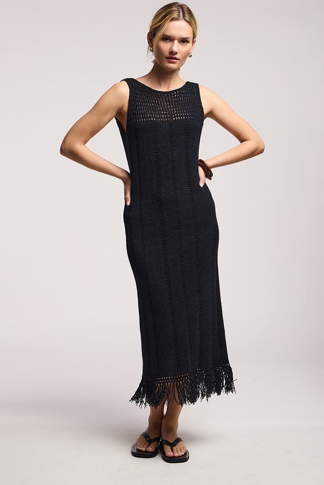Image shows a model wearing the Toma Dress in Black.