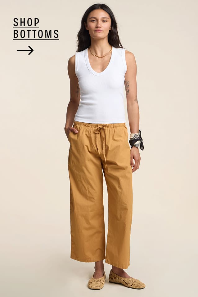 Image shows a model wearing the Allegra Bottoms in Teddy. Text Reads : Shop Mens