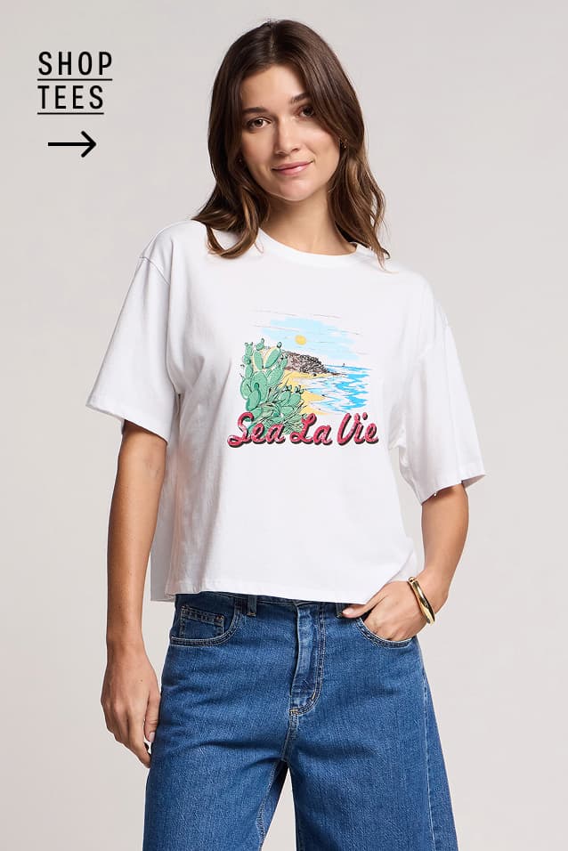 Image shows a model wearing the Sammy Tee in Sea La Vie. Text Reads : Shop Womens