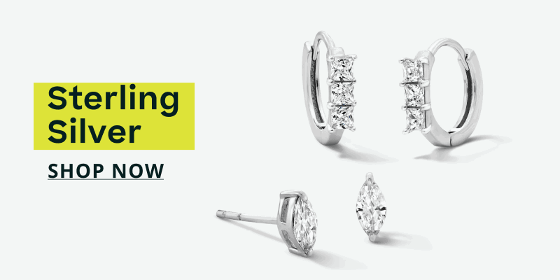 Silver-set crystal huggie hoops & marquise-cut stone studs. Sterling silver. Click here to shop now