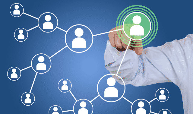 A hand pointing to a green-highlighted profile icon on a network of interconnected user icons against a blue background.