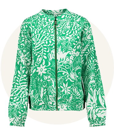 Green zip-up jacket with white floral pattern, long sleeves and round neckline, shown front-facing against a light neutral background.