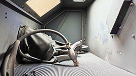 Close-up of media blast cabinet before maintenance