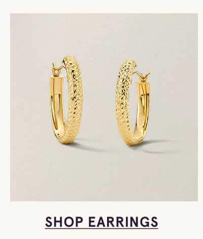 Classic gold hoops with a softly textured finish. Click here to shop earrings