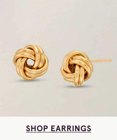 Pair of gold, textured love-knot studs. Click here to shop earrings