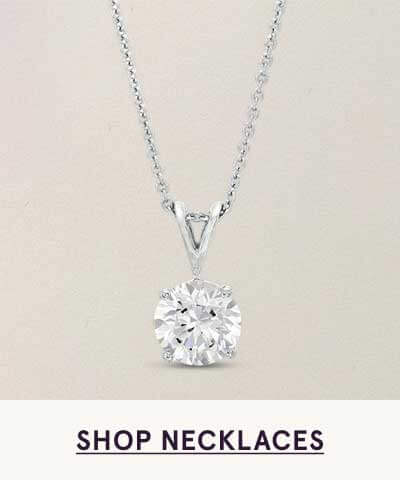 Simple silver chain with brilliant-cut solitaire diamond pendant. Click here to shop necklaces
