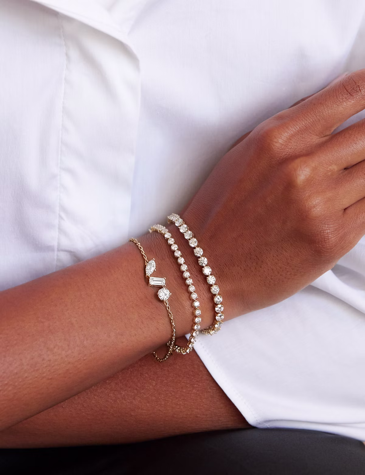 From brilliant tennis bracelets to more delicate designs, create a layered look that’s true to you.