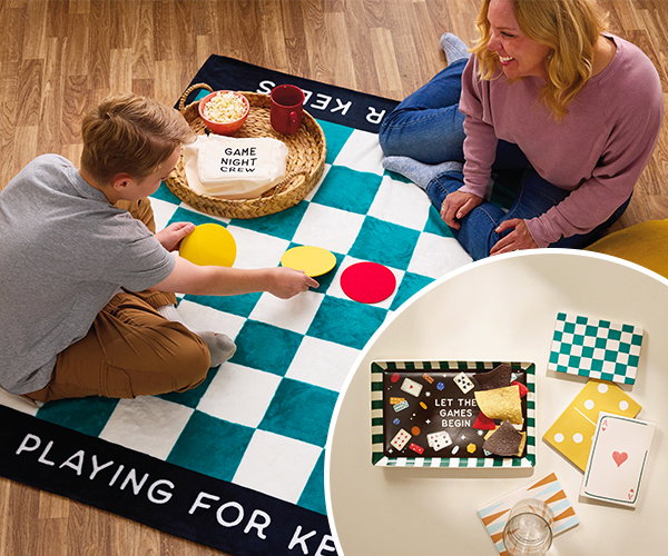 Mom and son with family game night blanket, plus snack tray and coasters.