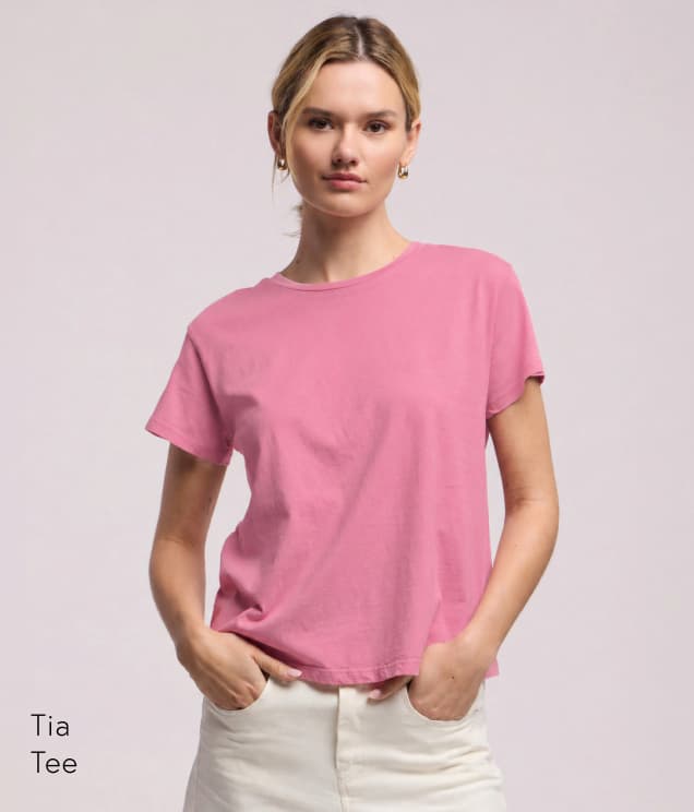 Image shows a model wearing the Tia Top in Sherbert. Text Reads: Tia Tee