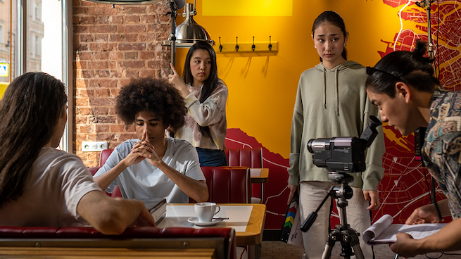 Film crew working in a diner