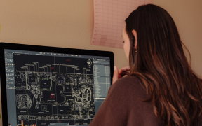 a woman looking at a computer screen
