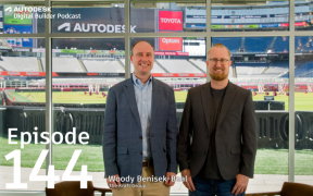 two men standing with Gillette Stadium in the background