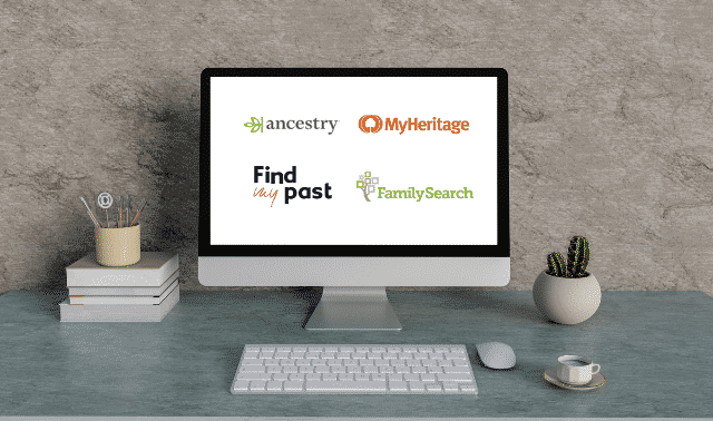 Computer monitor showing Ancestry, MyHeritage, FamilySearch and FindMyPast on screen