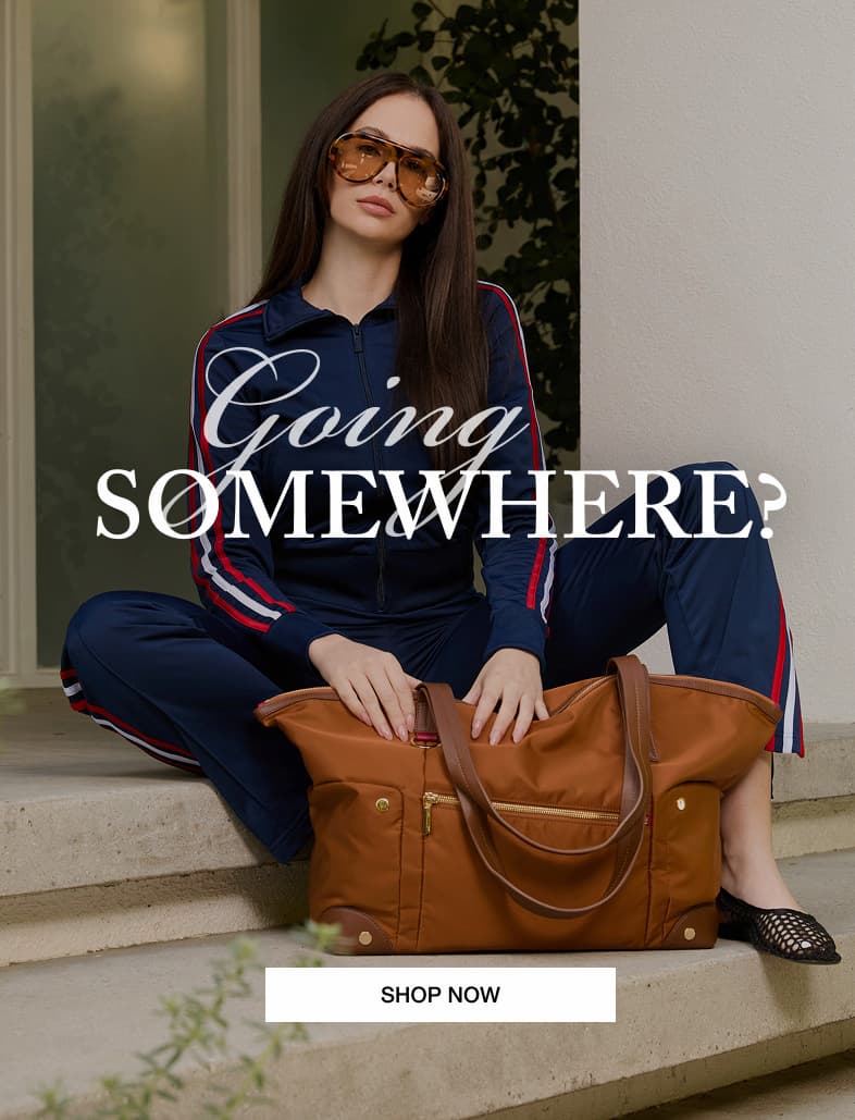 Model sitting with the Hammitt Zoe Weekender in Amber Italian nylon with the message "Going Somewhere?"