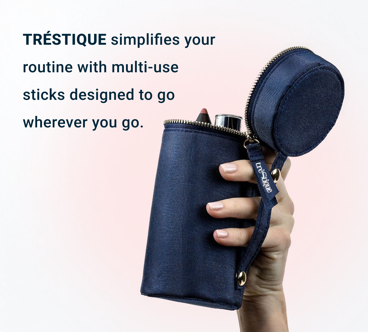 TRÉSTIQUE pouch beside a carry-on bag or travel tote.