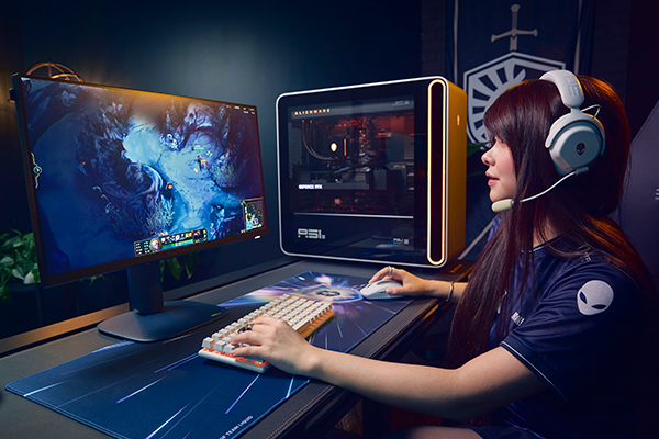 Gamer playing on a Alienware Gaming Desktop and Monitor
