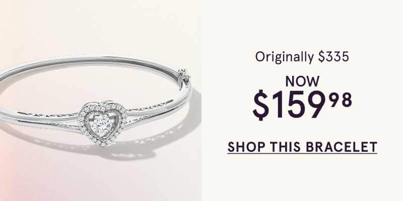 Silver bangle with central open-heart motif encrusted with diamonds.  Orig: $335. Now: $159.98. Click here to shop this bracelet