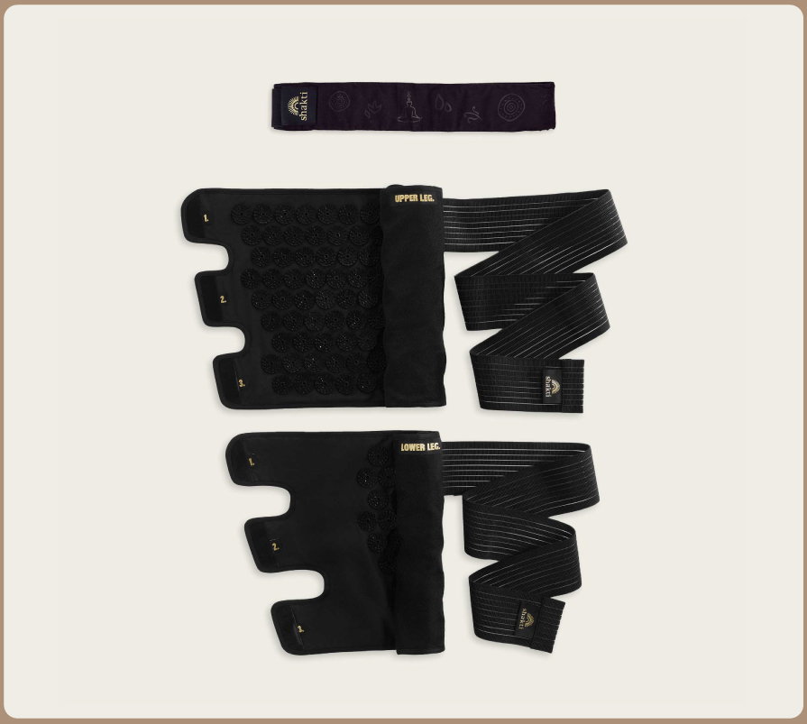 Flat lay of Shakti Acupressure Leg Wraps and Headband