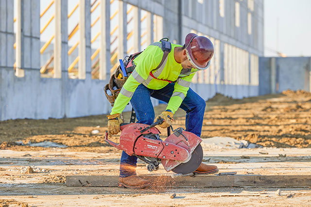 a man wearing the Resistor 11" Waterproof Nano Comp Square Toe boots in russet (tan).