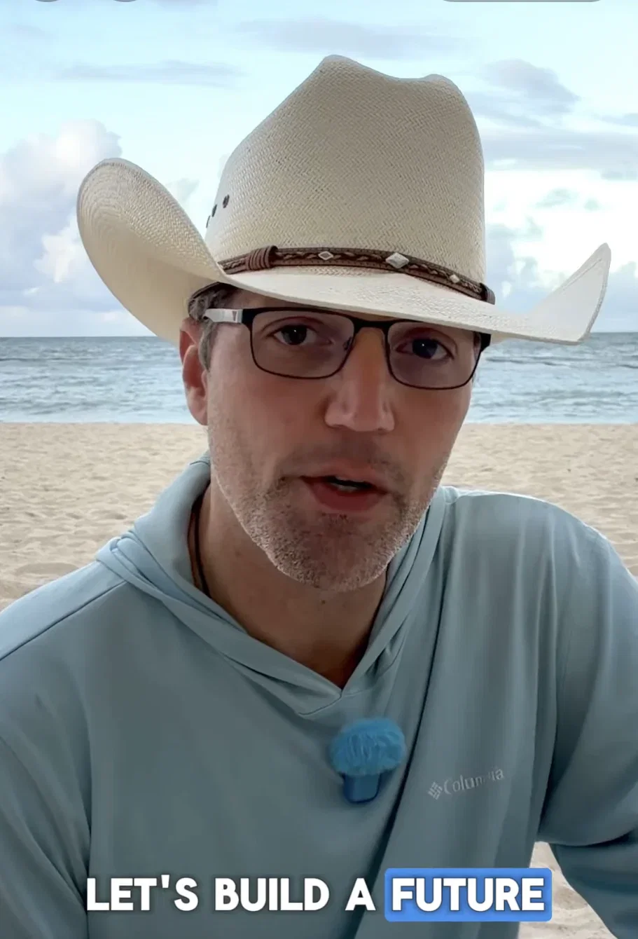 man in a cowboy hat talking