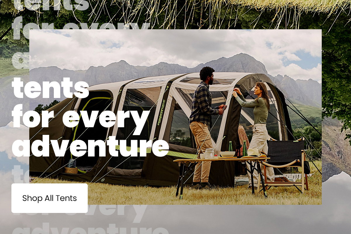 Two people setting up a large inflatable camping tent in a grassy field with mountains in the background, alongside text reading “tents for every adventure” and a “Shop All Tents” button.