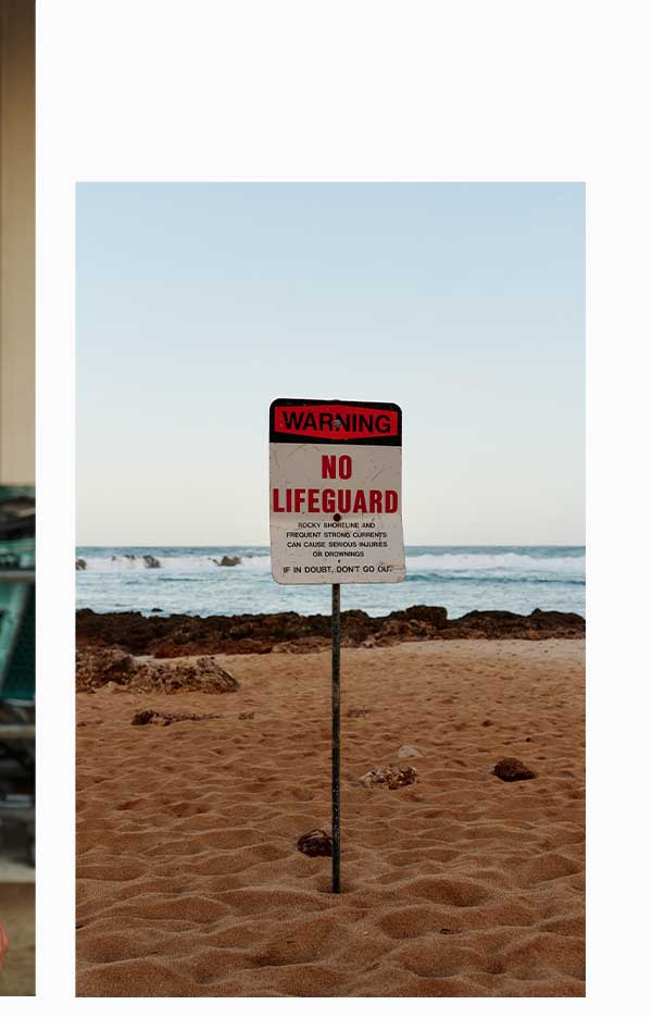 No Lifeguard sign on the beach