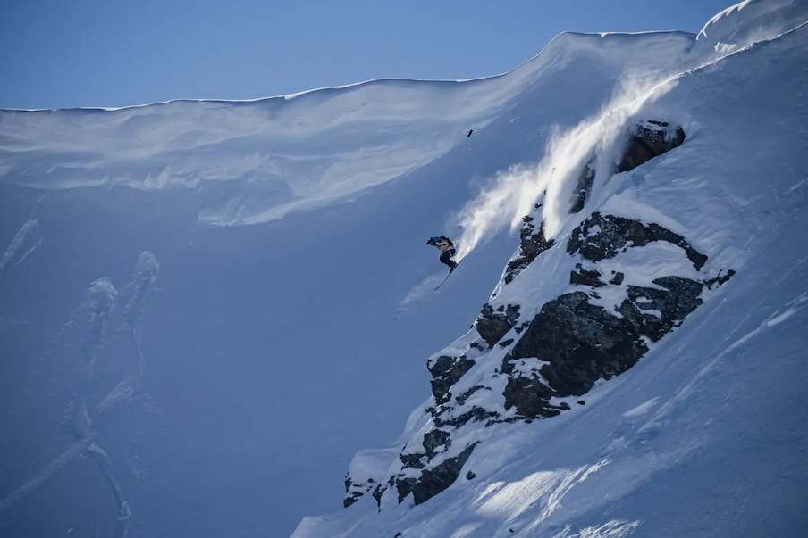 skier dropping cliff