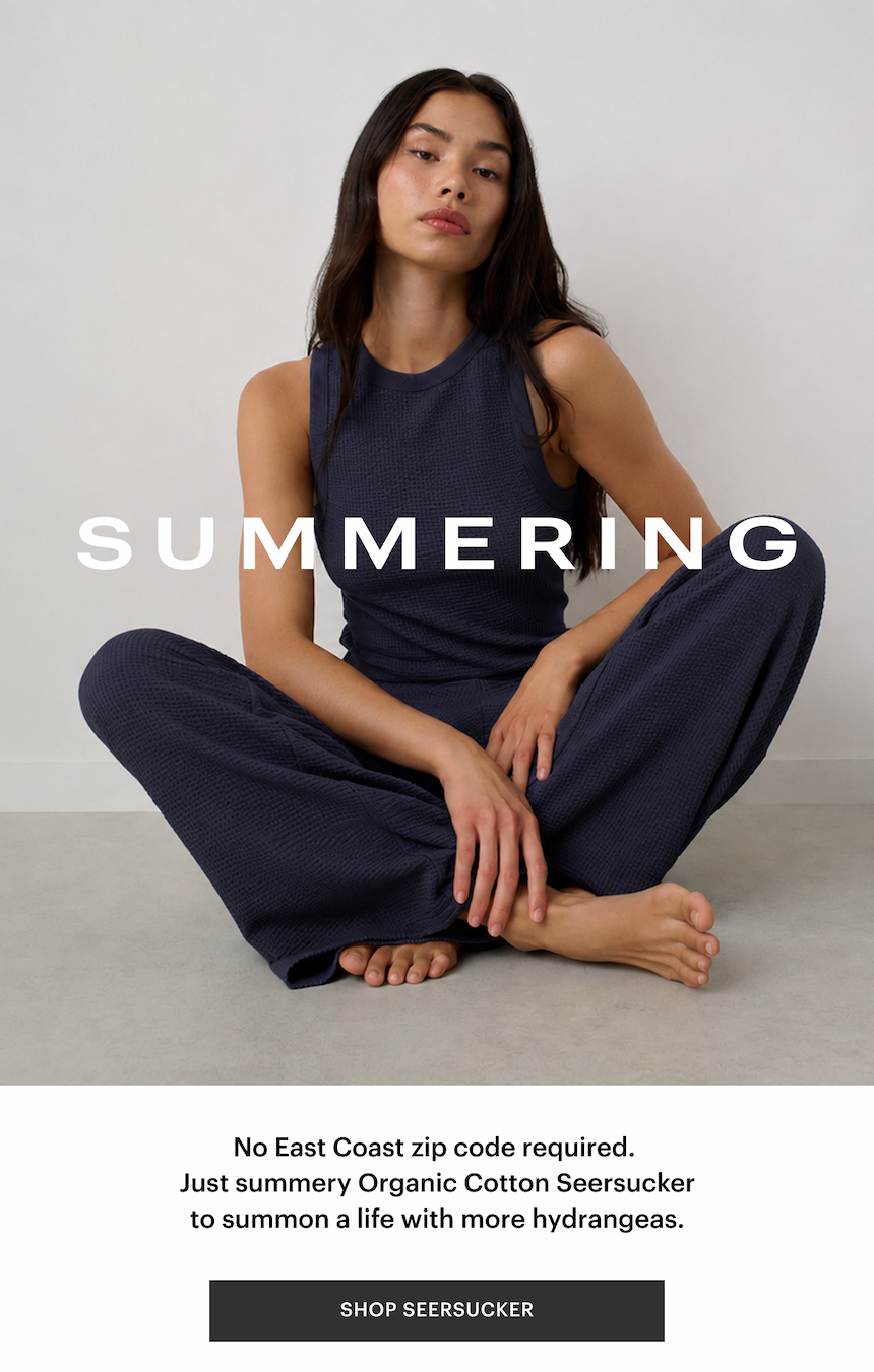 image of woman in dark blue seersucker set 