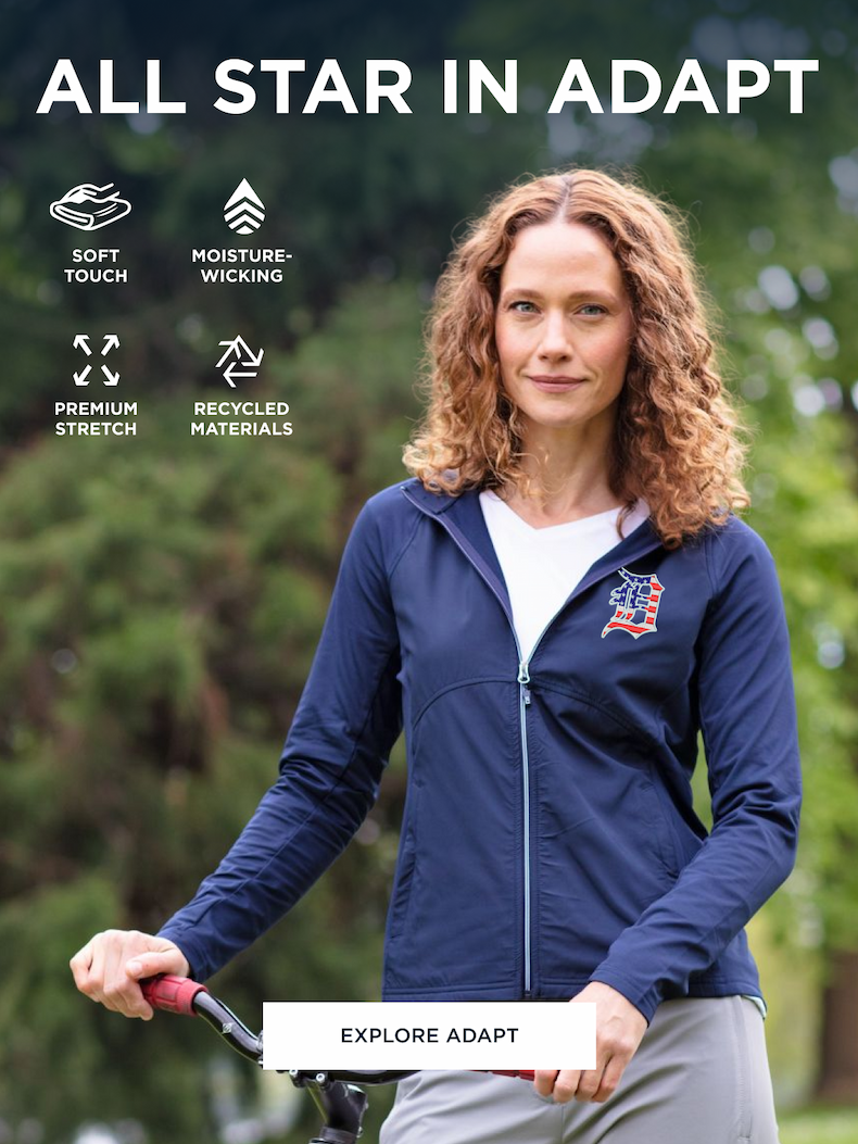 Woman wearing an Adapt Stripe quarter zip while biking | Explore Adapt