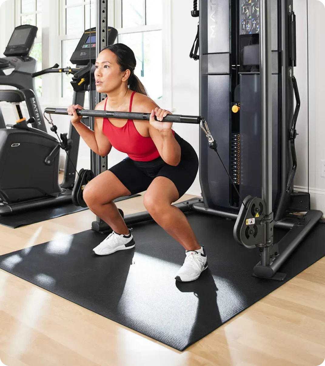 Woman working out with a Matrix FTR30 at home.